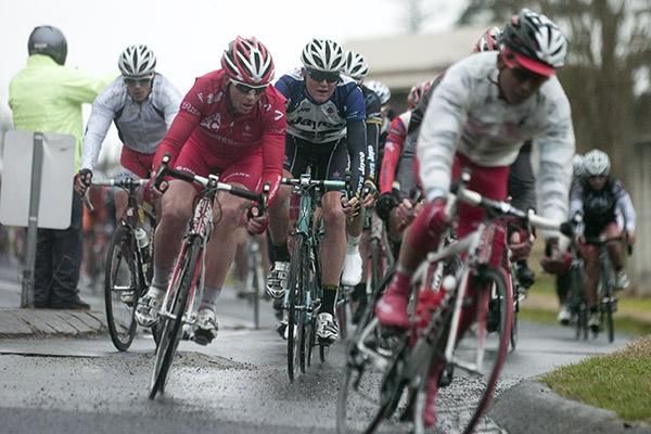 The peloton work their way around a slippery corner heading into the final twenty kilometres of the stage.