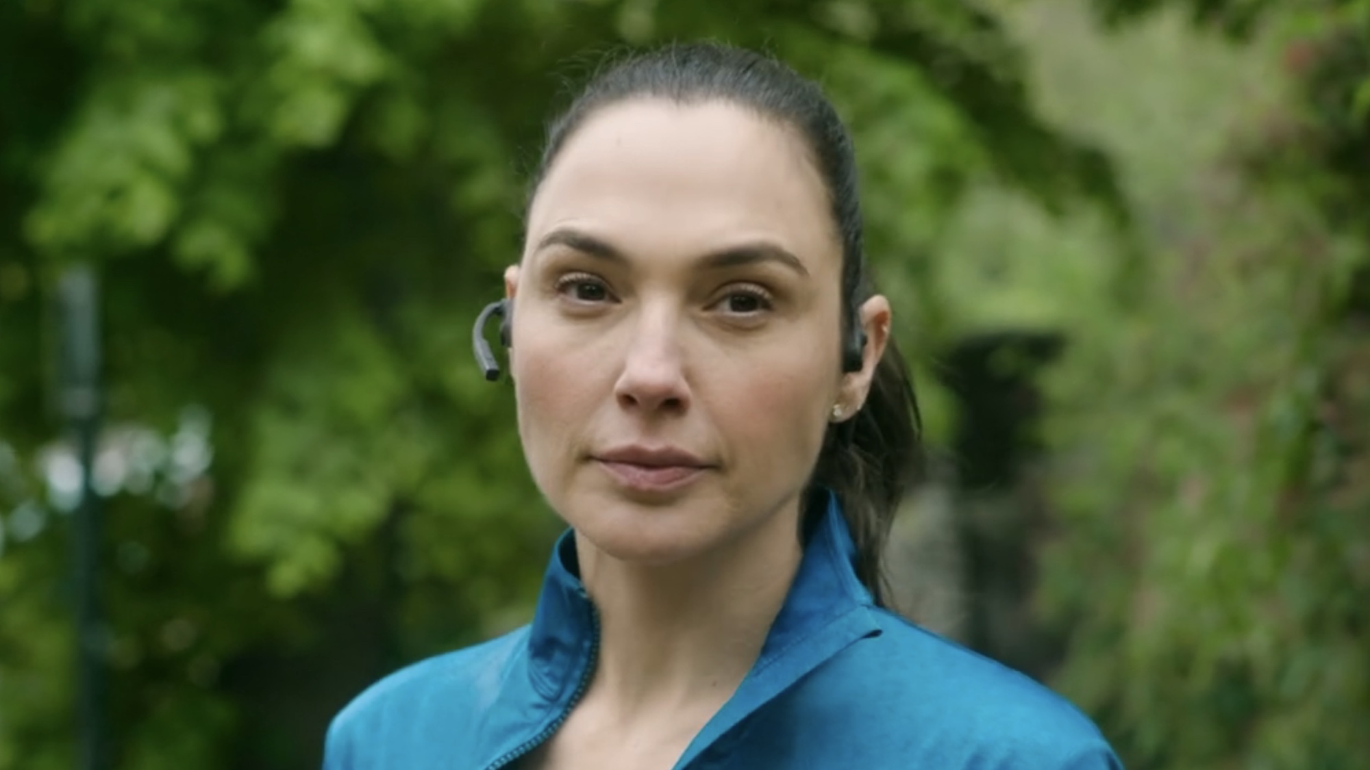 Gal Gadot talking on the phone at the start of The Runner. 