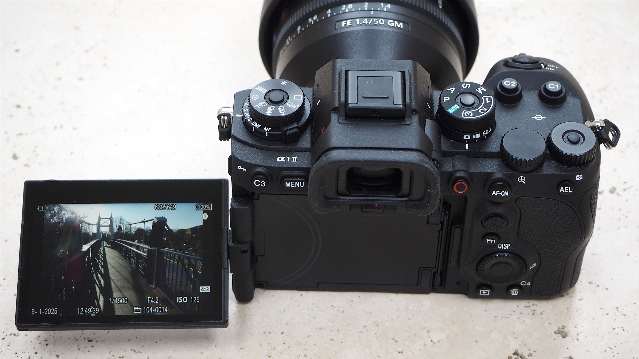 A back view of the Sony A1 II camera with the screen flipped out to the left.