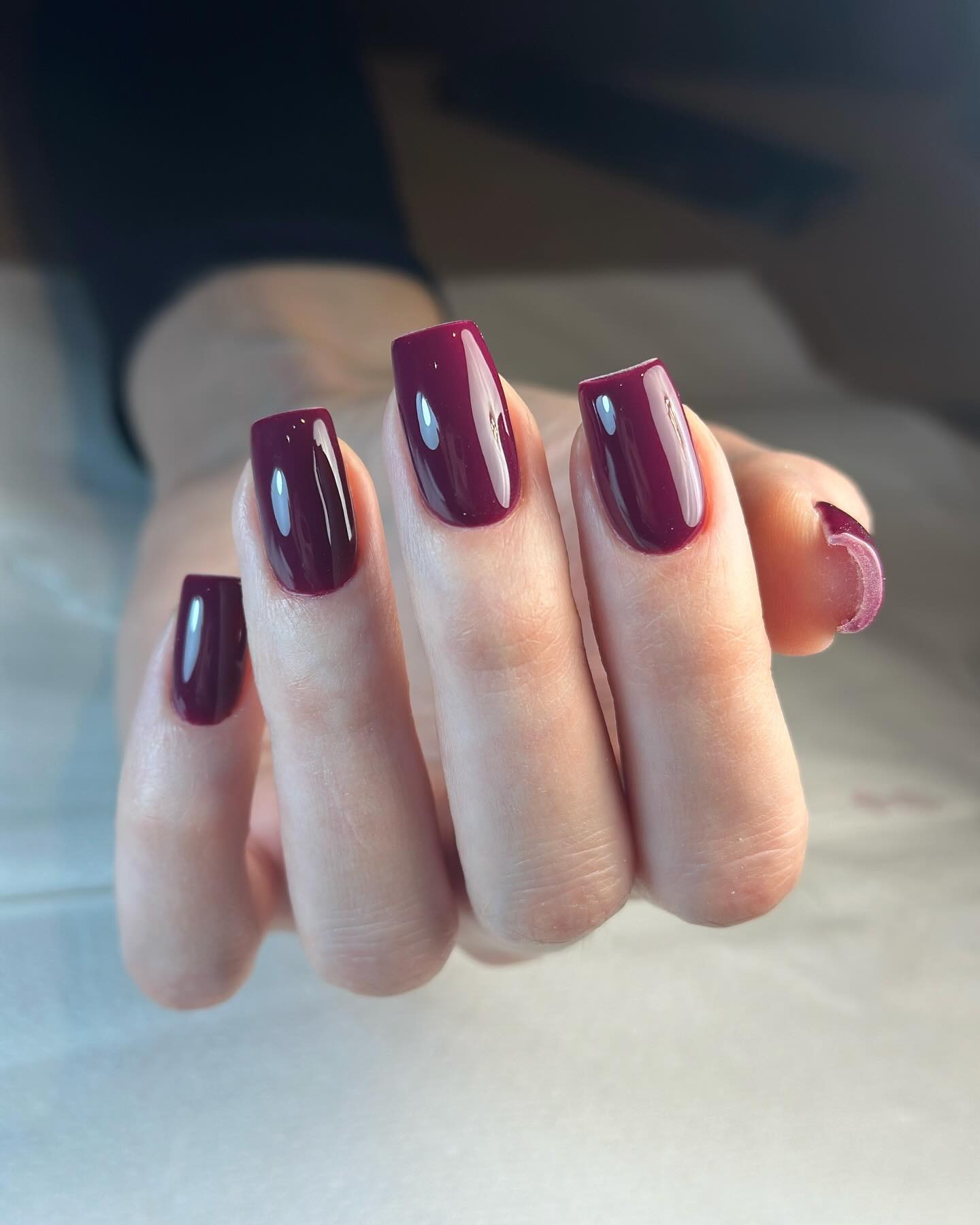 A long, square aubergine manicure