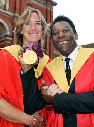 Olympic Gold medal rower Katherine Grainger, a graduate of Edinburgh University, stands with former footballer Pele, who was presented with an honorary degree by the university