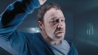 A close up of Stephen Graham's Patrick Mulligan in a cell in Venom 3