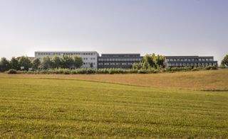 View across a grassy area towards the school building