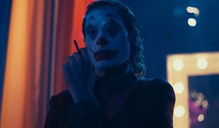 Joker smoking a cigarette backstage at Murray Hamilton's show