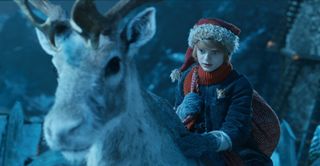 Henry Lawfull stars in 'A Boy Called Christmas' as a boy riding on a reindeer