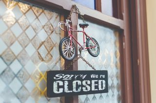 Image of closed bike shop sign