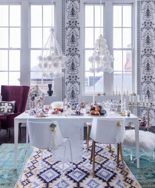 White themed Christmas table with colorful decorations