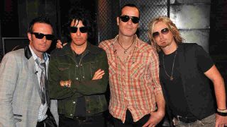 Stone Temple Pilots posing for a photograph in 2010