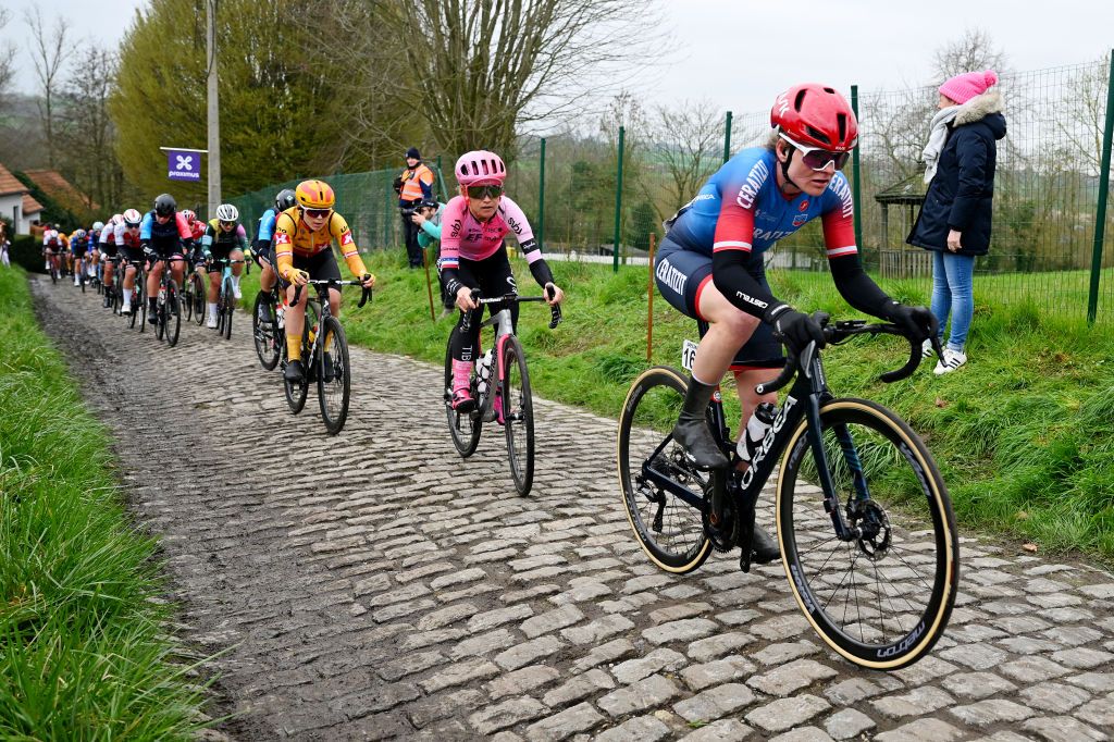 OUDENAARDE BELGIUM APRIL 02 LR Lauren Stephens of The United States and Team EF EducationTibcoSvb and Marta Lach of Poland and Team CeratizitWNT Pro Cycling compete passing through a cobblestones sector during the 20th Ronde van Vlaanderen Tour des Flandres 2023 Womens Elite a 1566km one day race from Oudenaarde to Oudenaarde UCIWWT on April 02 2023 in Oudenaarde Belgium Photo by Luc ClaessenGetty Images