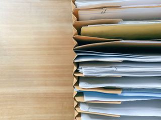 Menopause and job loss: A stack of paperwork