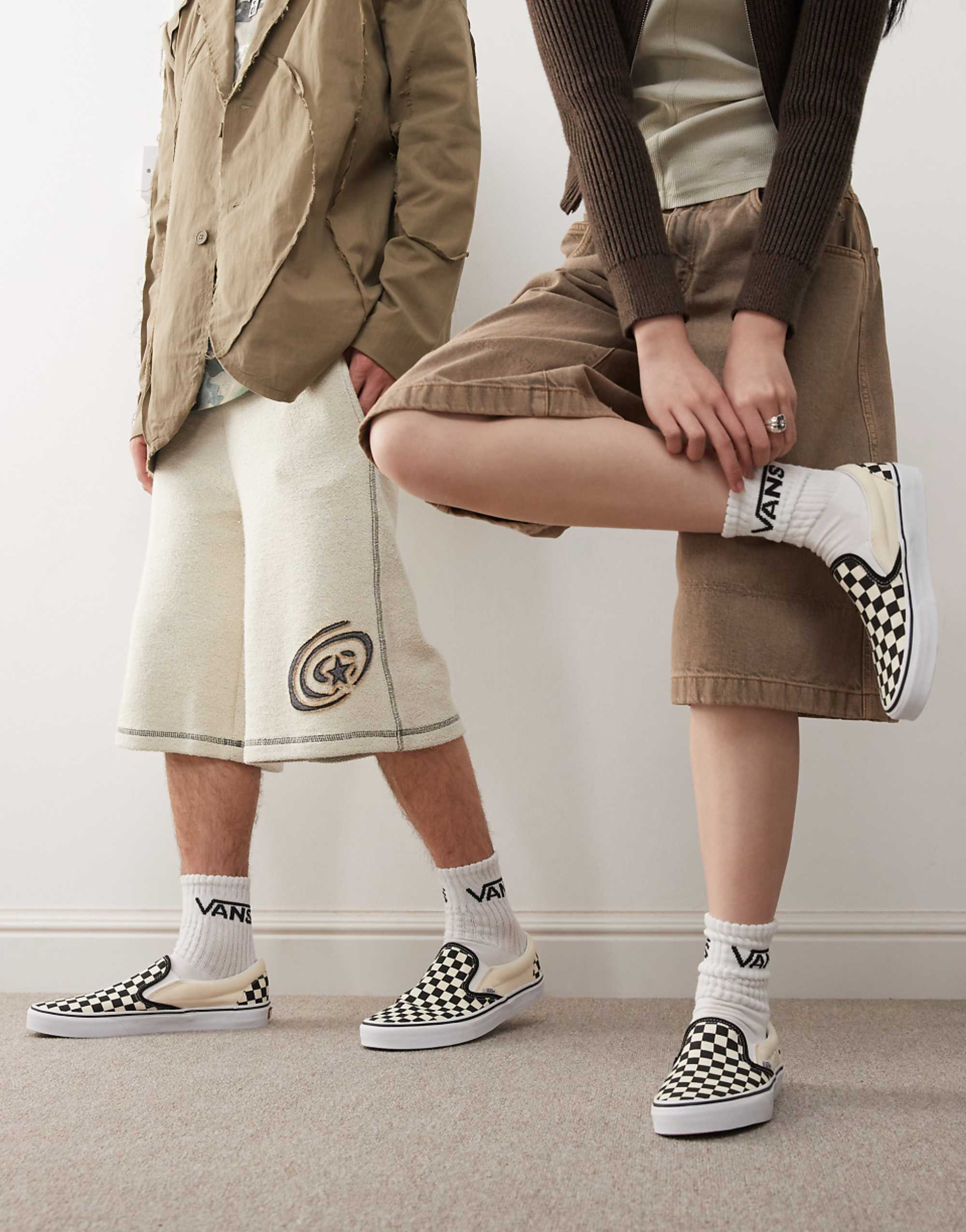 Vans Slip-On Checkerboard Trainers in Black and White