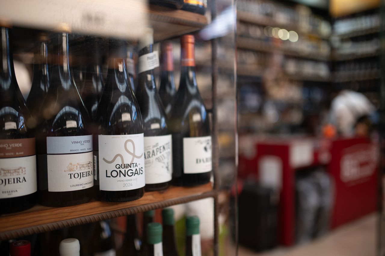 Sample images taken with Viltrox AF 35mm F1.4 Pro and Sigma 35mm f/1.4 DG HSM Art lenses; bottles of wine in a shop