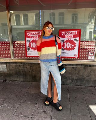 5 Spring Outfits: Laura wears a colourful knit jumper with a denim midi skirt.