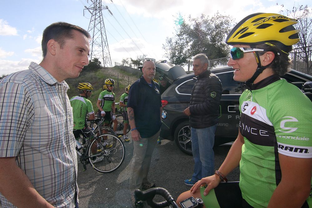 Omer Kem talks with a Cylance rider at the team's recent camp in California