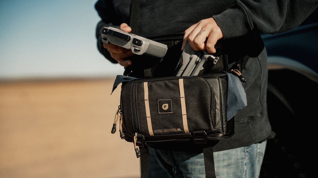 The PolarPro RoadRunner Shoulder Bag with a drone and controller