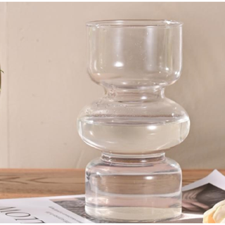 clear glass vase with a curved shape