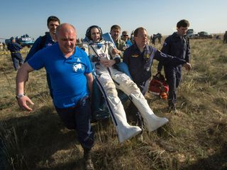 Expedition 38-39 NASA astronaut Rick Mastracchio shortly after landing in May 2014. After six months on the International Space Station, most astronauts have trouble walking and doing other normal activities in Earth gravity.