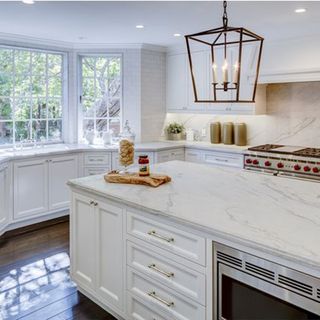 kitchen with white cabinet and wooden flooring