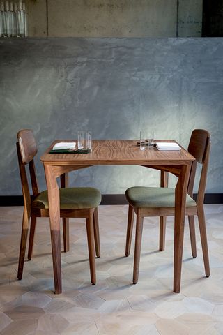 Table and chairs at Londrino restaurant, London, UK