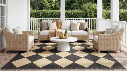 a decorative outdoor rug from amazon on a patio with patio furniture