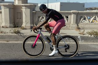 MAAP x Bleach Design Werks kit worn by male cyclist on road bike