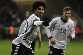 Serge Gnabry, left, celebrates one of his three goals