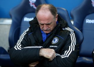 Luiz Felipe Scolari checks his watch as Chelsea take on Bolton
