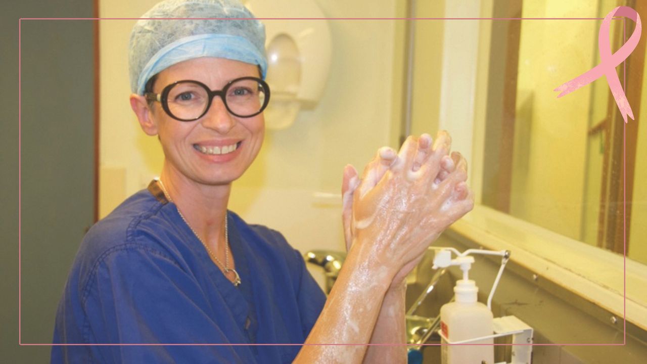 Dr Liz O&#039;Riordan wears blue hospital scrubs and a hair covering as she washes her hands