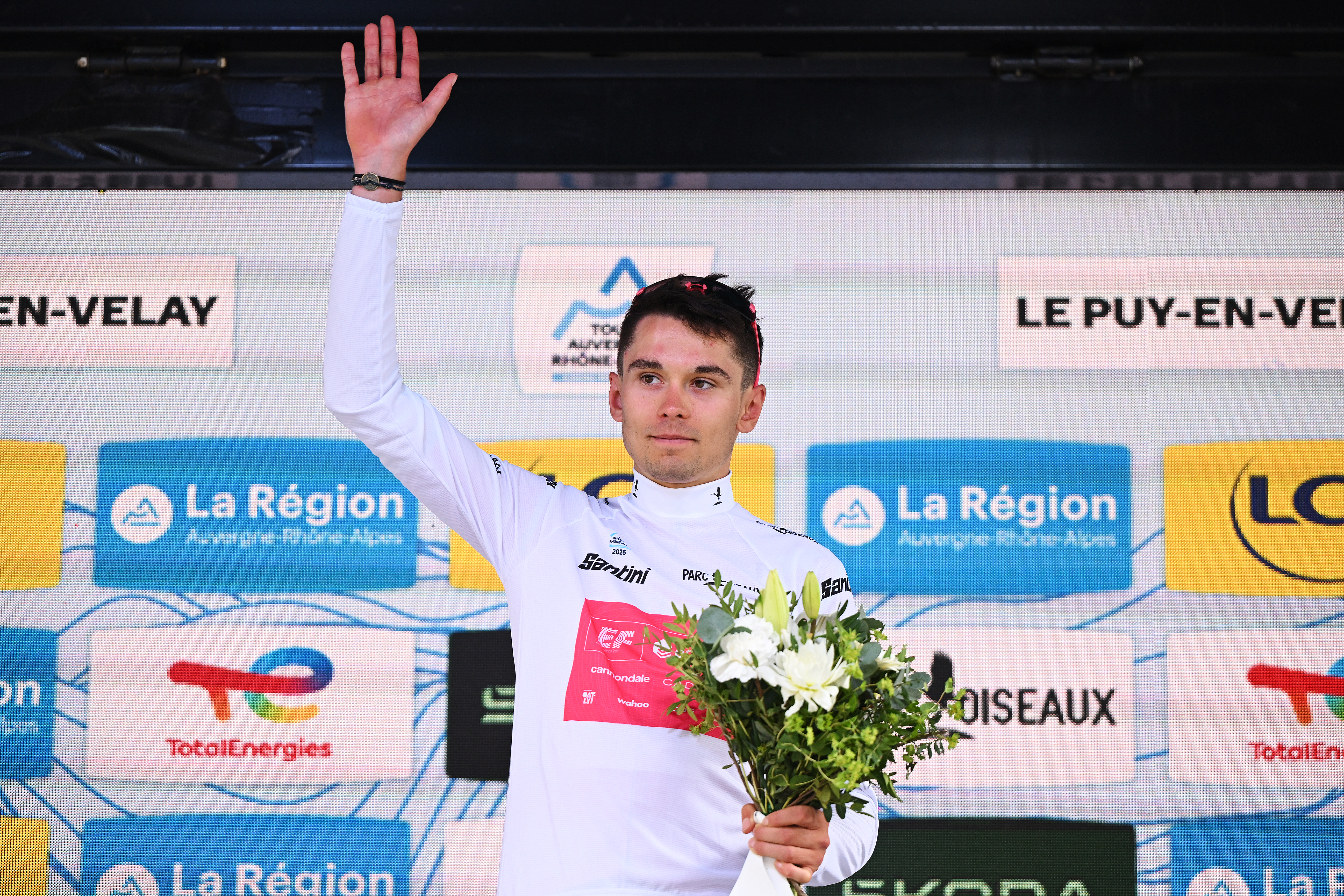 LE PUY-EN-VELAY, FRANCE - JUNE 08: Alex Baudin of France and Team EF Education - EasyPost celebrates at podium as White Best Young Rider Jersey winner during the 78th Tour Auvergne-Rhone-Alpes 2026, Stage 2 a 234.3km stage from Saint-Martin-le-Vinoux to Le Puy-en-Velay 624m / #UCIWT / on June 08, 2026 in Le Puy-en-Velay, France. (Photo by Dario Belingheri/Getty Images)