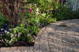 gravel and brick flooring with flowerbed