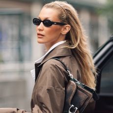 Bella Hadid was spotted in Paris wearing a brown Coach tabby bag