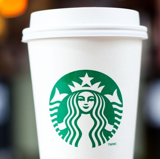 Grande Starbucks to go cup on table