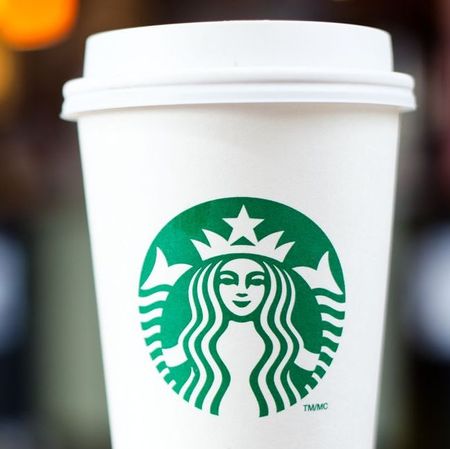 Grande Starbucks to go cup on table