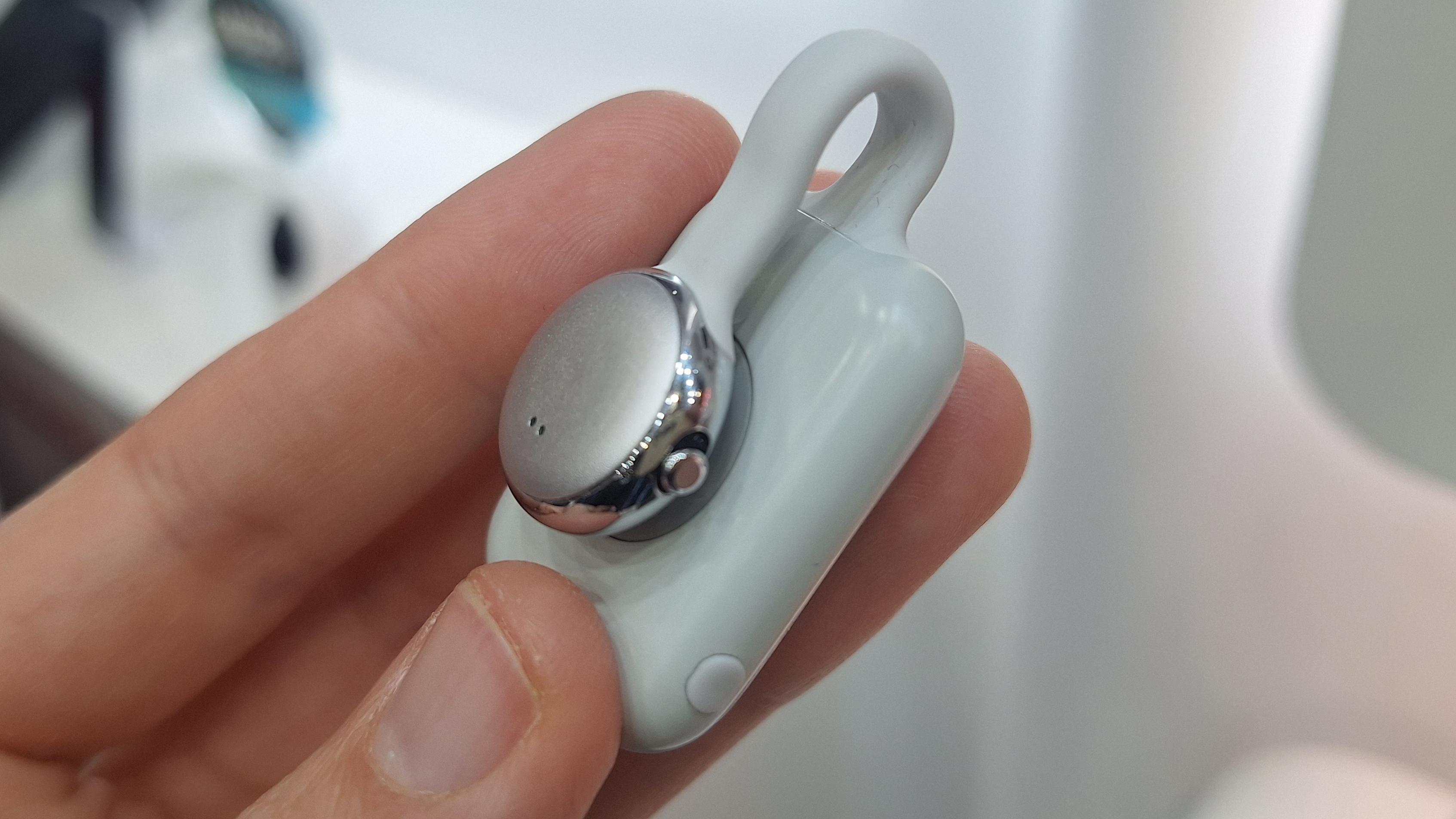 SwitchBot AI MindClip in writer's hand