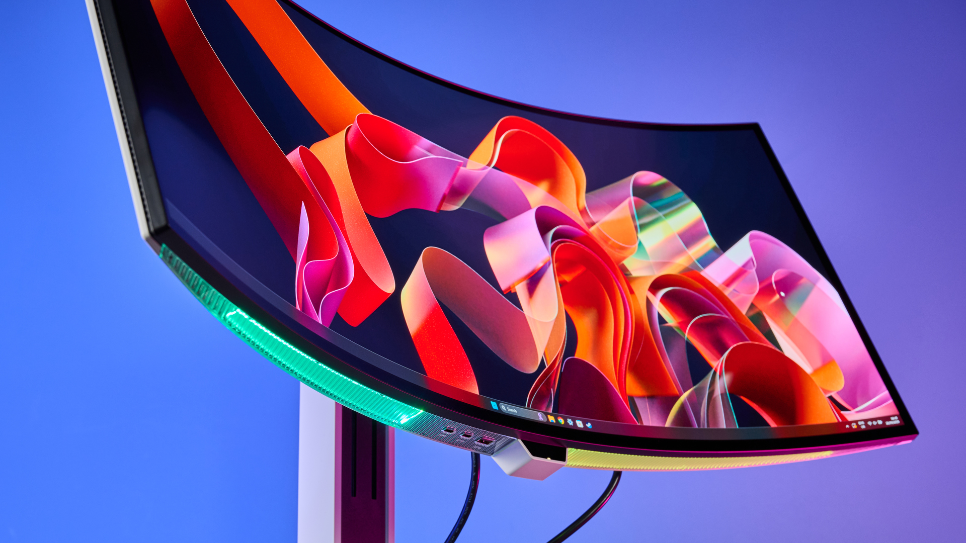 The Lenovo Legion Pro 34WD10 monitor tilted upwards with a colorful background on the display