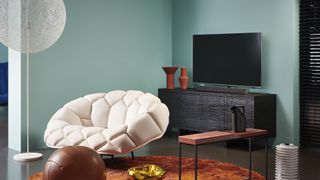 A cosy living room with a Philips TV in the front.