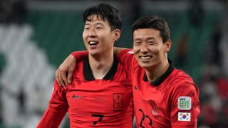 Son Heung-Min (L) and Kim Tae-Hwan (R) of South Korea prepare for the Jordan vs South Korea semi-final of the AFC Asian Cup 2024.