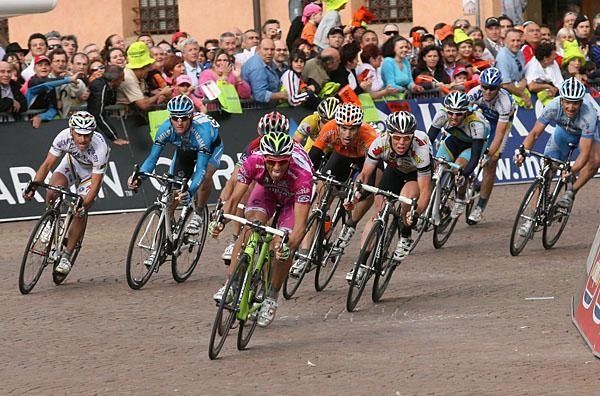 Bennati gets to the final turn first with a bike length on McEwen.