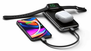 Satechi Quatro Wireless Power Bank chaging iPhone, Apple Watch, and AirPods.