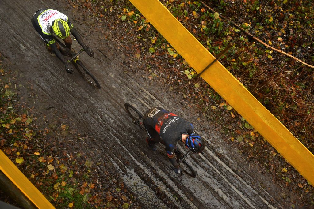 BOOM BELGIUM DECEMBER 04 LR Quinten Hermans of Belgium and TormansCircus Cyclo Cross Team and Toon Aerts of Belgium and Team Baloise Trek Lions compete on a muddy sector during the 7th Superprestige Cyclocross Boom 2021 Mens Elite SPBoom Superprestige2022 on December 04 2021 in Boom Belgium Photo by Luc ClaessenGetty Images