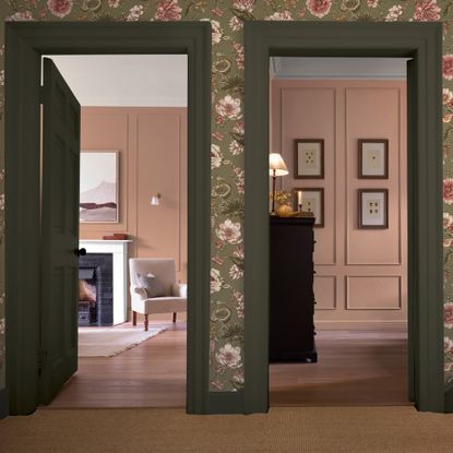 A hallway with two open dark green doorways leading into rooms painted in Graham & Brown's Rose Earth pink shade