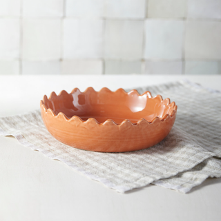 orange bowl with a scalloped rim