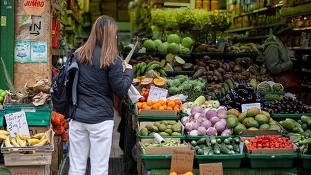 Woman at a greengrocer's