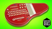 A Suzuki Omnichord on a green background