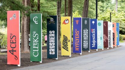 Signs for the 12 teams during practice for the LIV Golf Invitational Series Boston