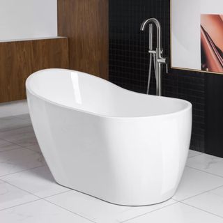 A Woodbridge Freestanding Soaking Acrylic Bathtub in a modern bathroom