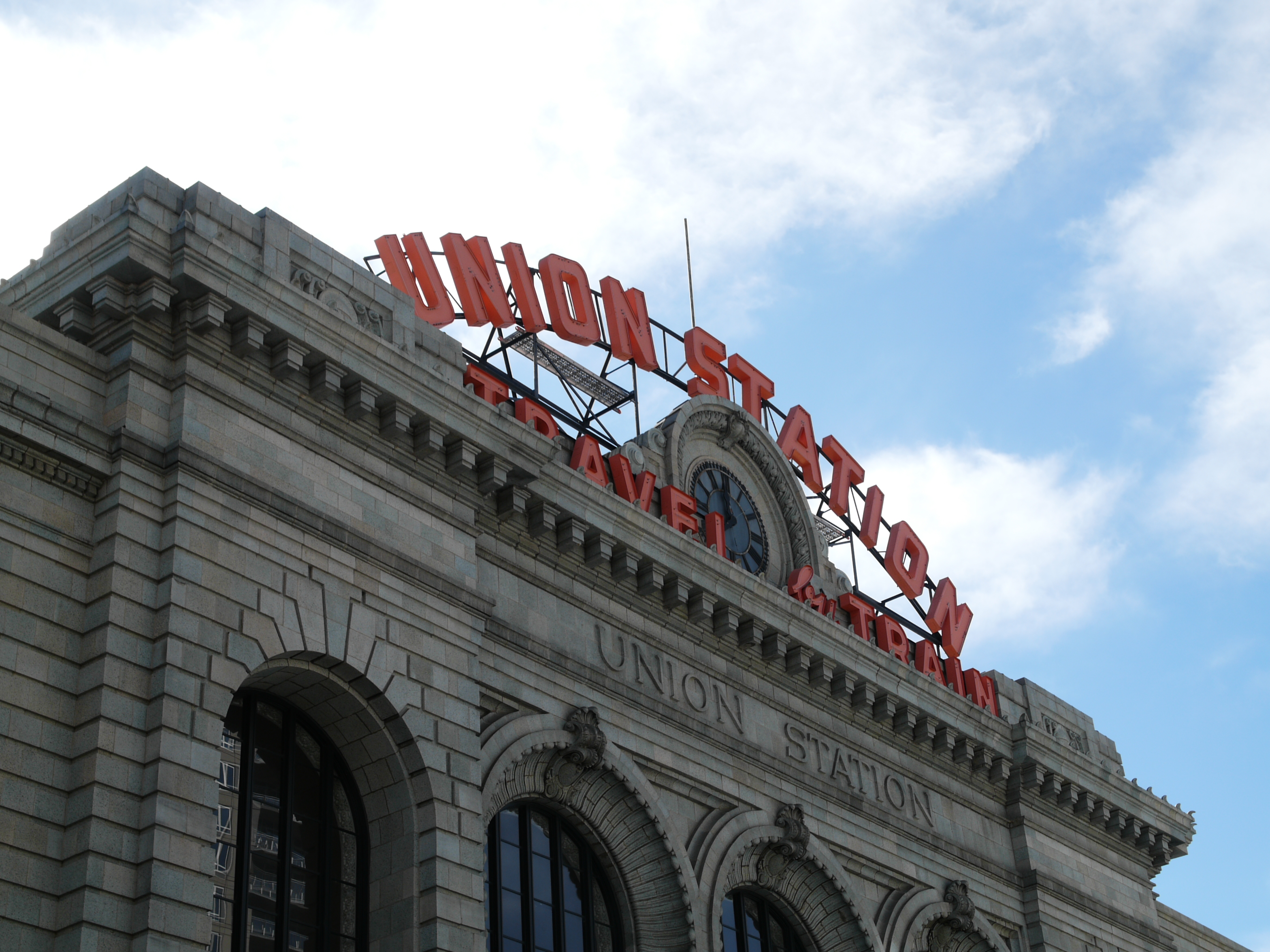 A street photo of a train station, shot on the Lumix L1