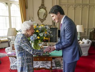 Queen Elizabeth II shakes hands with Canadian Prime Minister Justin Trudeau