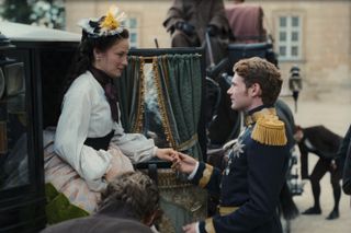 Elisabeth (Devrim Lingnau) is helped out of a carriage and hold hands with Franz (Philip Froissant) in 'The Empress.'