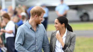 dubbo, australia october 17 prince harry, duke of sussex and meghan, duchess of sussex meet local community members as they attend the naming dedication and unveiling of a new aircraft in the royal flying doctor service rfds fleet at dubbo airport on october 17, 2018 in dubbo, australia the duke and duchess of sussex are on their official 16 day autumn tour visiting cities in australia, fiji, tonga and new zealand photo by karwai tangwireimage